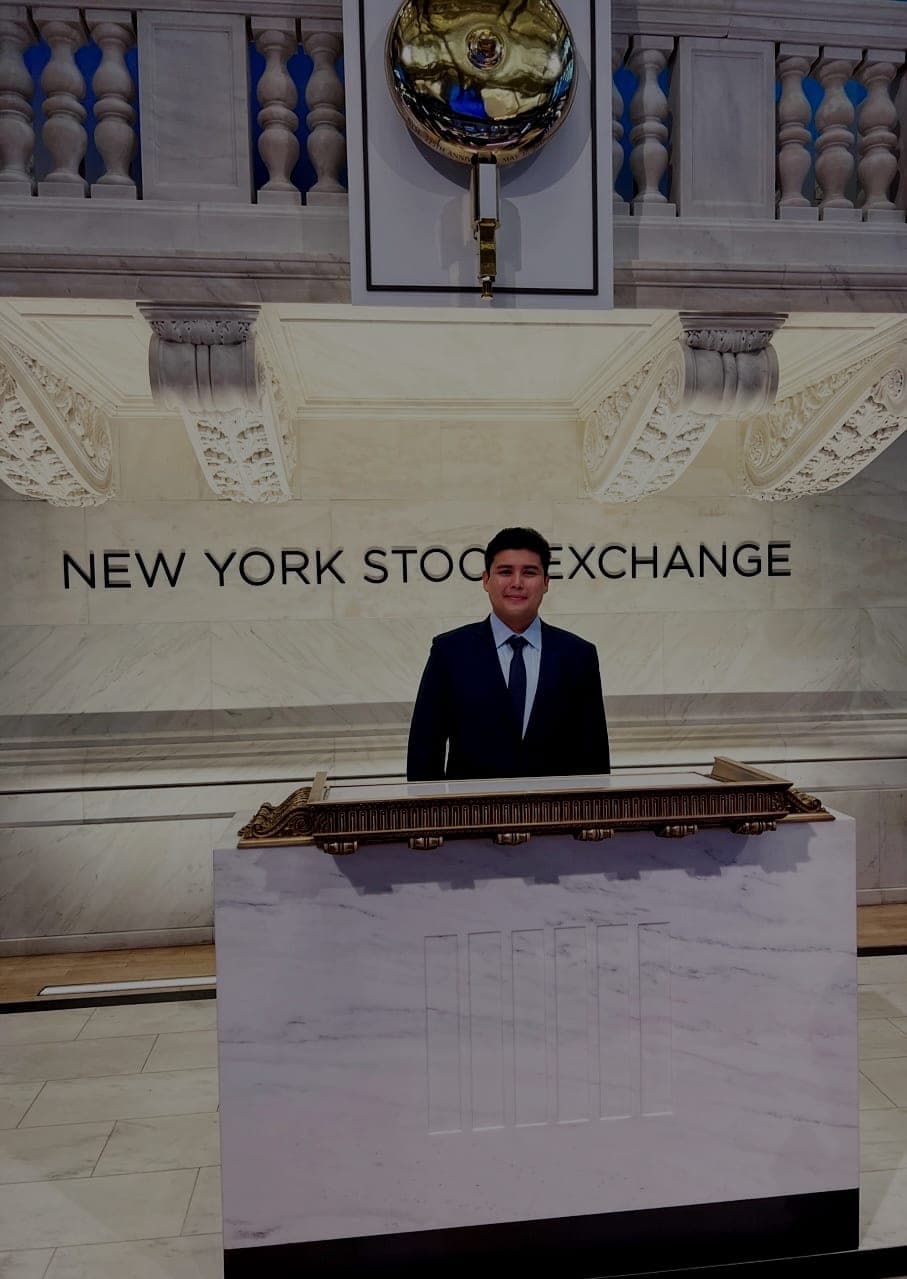 Jeffrey Escobar at the bell podium inside the New York Stock Exchange in May 2023